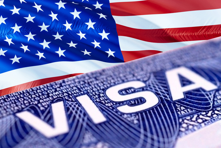 Composite image of part of an American visa and the American flag.