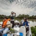 Carolina da Silva and graduate students migratory birds on the Paraguay River in Brazil's Pantanal, the world's largest wetland.