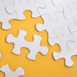 An image that shows an incomplete jigsaw puzzle.