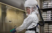 CDC scientist wearing personal protective equipment.