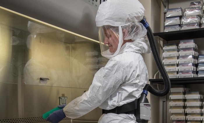 CDC scientist wearing personal protective equipment.