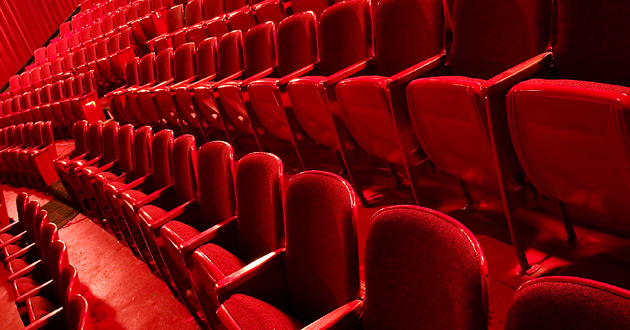 Row of red theater seats.