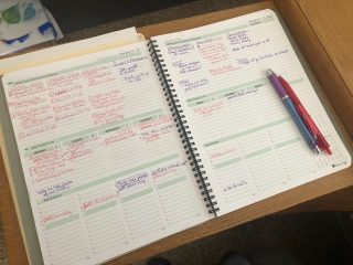 Kendall's open planner. Tasks are color-coded, red and purple.